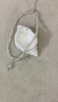 faux pearl necklace and teardrop earrings